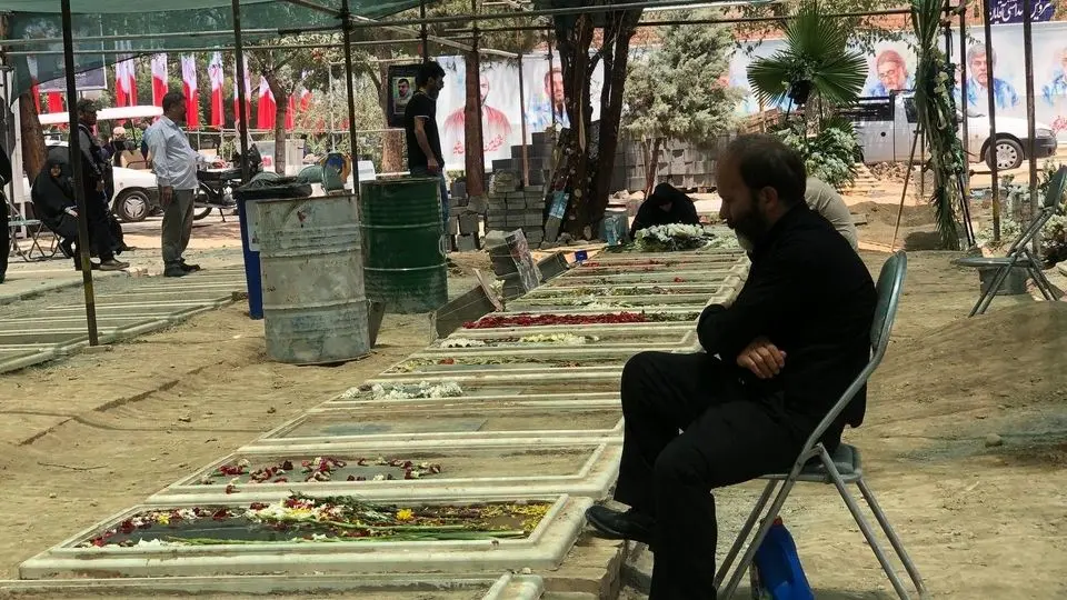 Crowd of families and friends bury the civilian victims of Israeli attacks