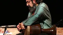 کمانچه‌ای بر دوش و چمدانی در دست
